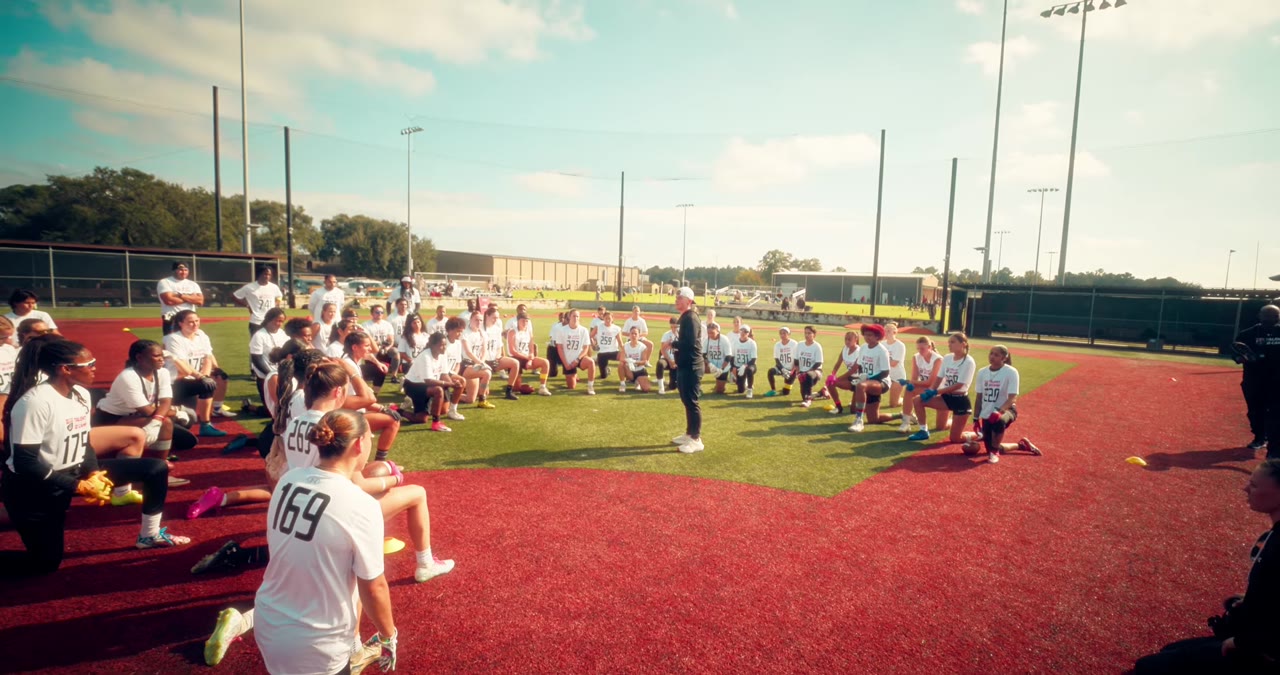 Athletes gathered on the field at a USA Football Talent ID combine