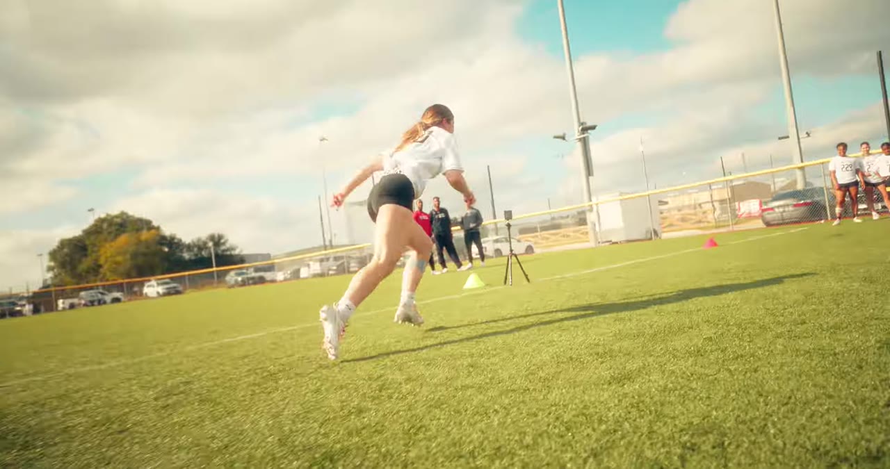 Athlete mid-sprint in a combine drill